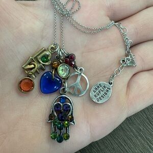Stunning Anne Koplik silver tone PEACE and LOVE necklace